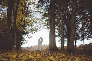 Wedding couple walking in woods